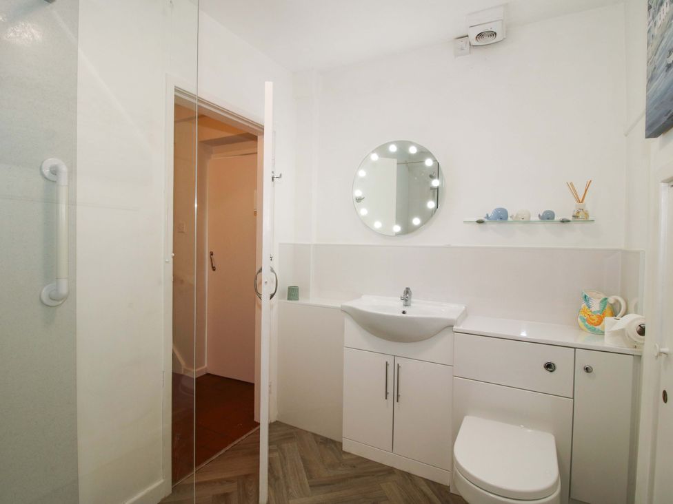 A bathroom with a sink and shower at Shepherd's Cottage Eudon Burnell near Bridgnorth