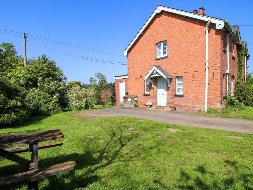 A house with a garden and picnic table at Shepherd's Cottage Eudon Burnell near Bridgnorth