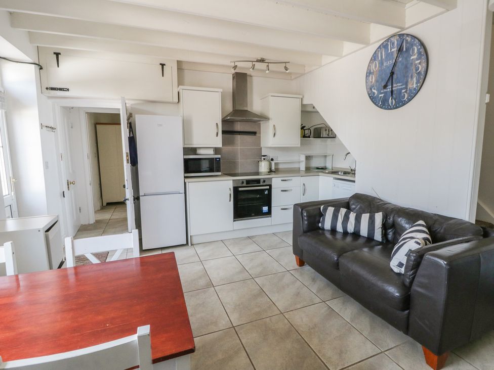 A kitchen with appliances and seating at Brynmorfa in Llandysul