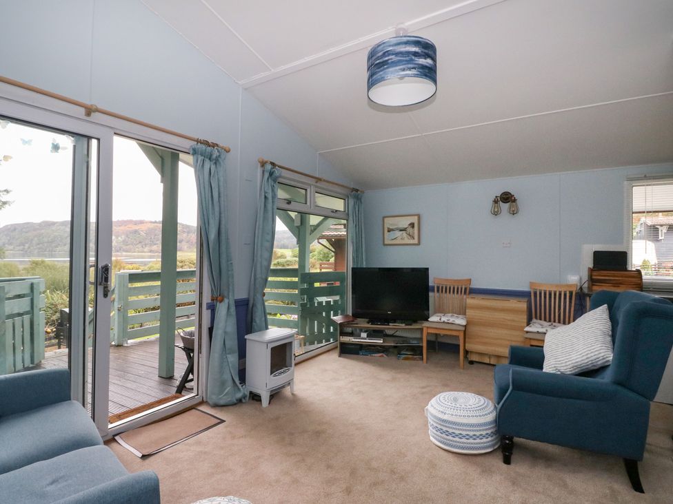 A living room with a sofa and television at Scarba in Oban