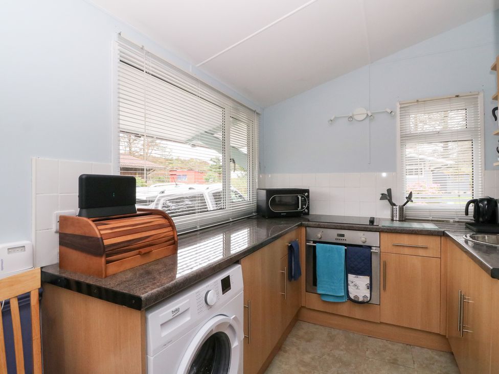 A kitchen with appliances and a window at Scarba in Oban