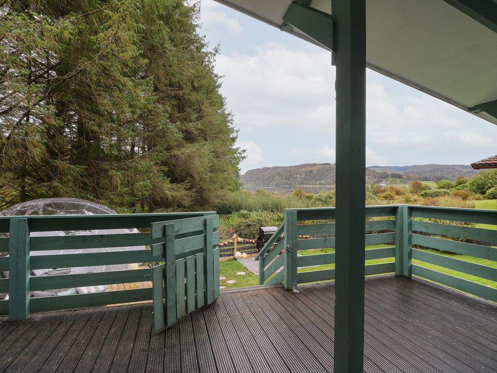 A decking area with a view of trees and landscape at Scarba in Oban