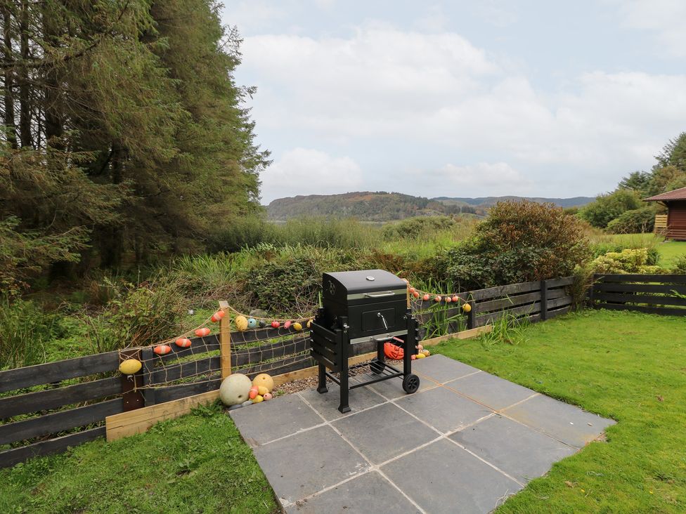 An outdoor area with a grill and decorative items at Scarba in Oban