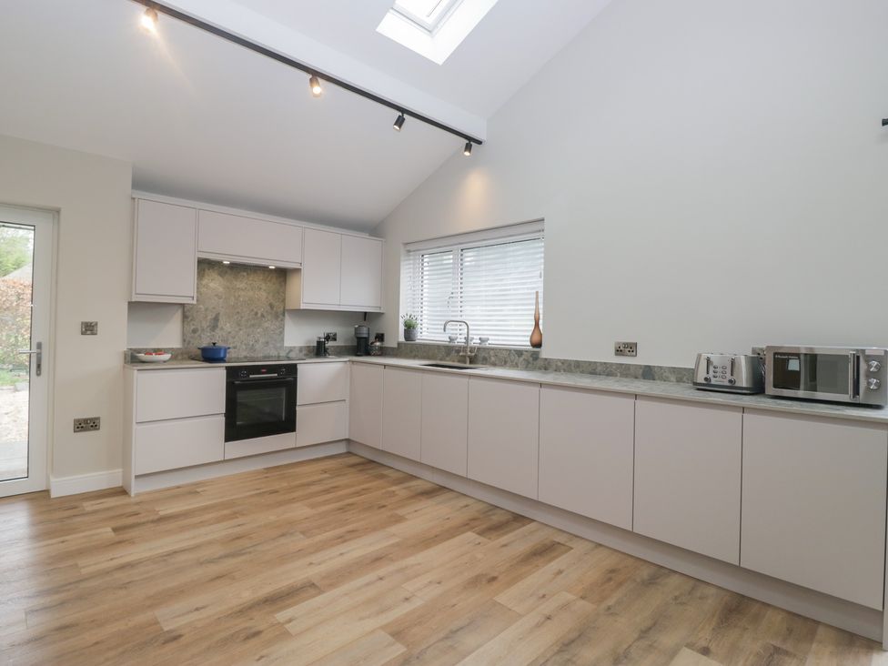 A kitchen with modern appliances at Cross Winds in Clapham