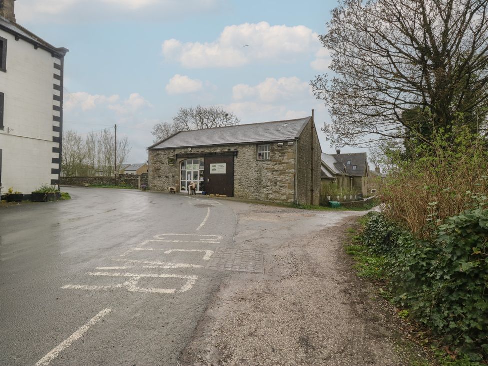 A building on a road with trees at Cross Winds in Clapham