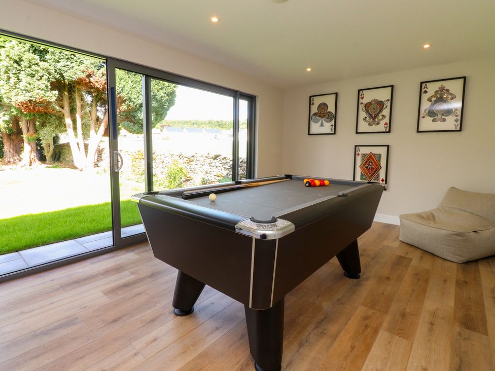A game room with a pool table and bean bag at Cross Winds in Clapham