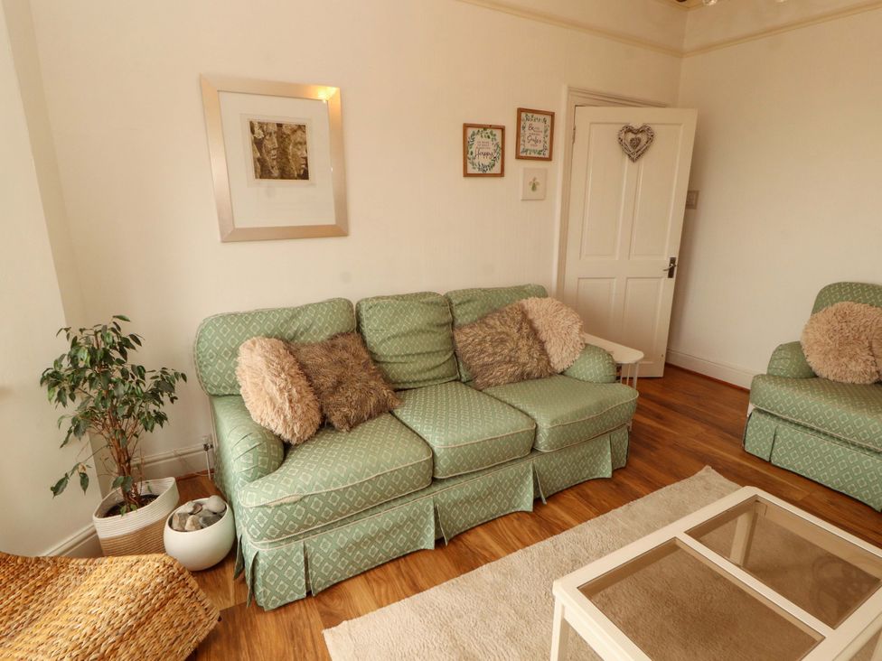 A living room with a sofa and coffee table at 2 The Crescent