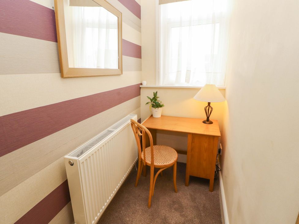 A workspace with a desk and a chair at 2 The Crescent