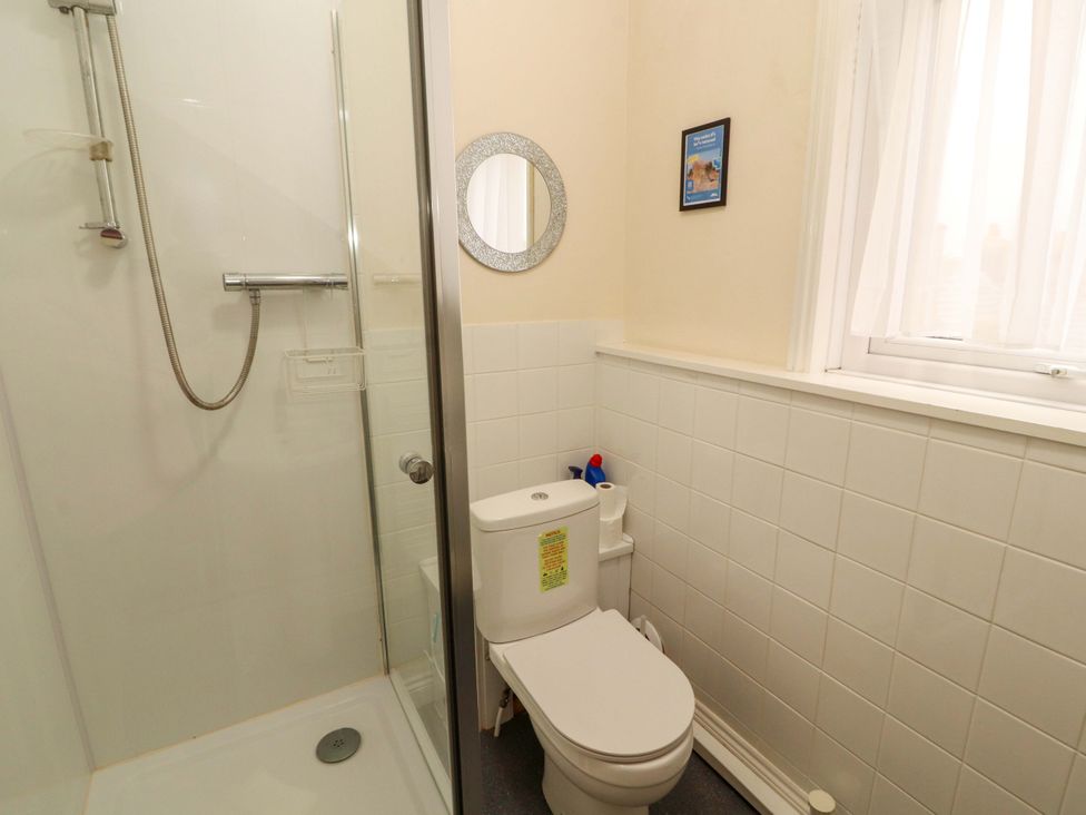 A bathroom with a shower and toilet at 2 The Crescent
