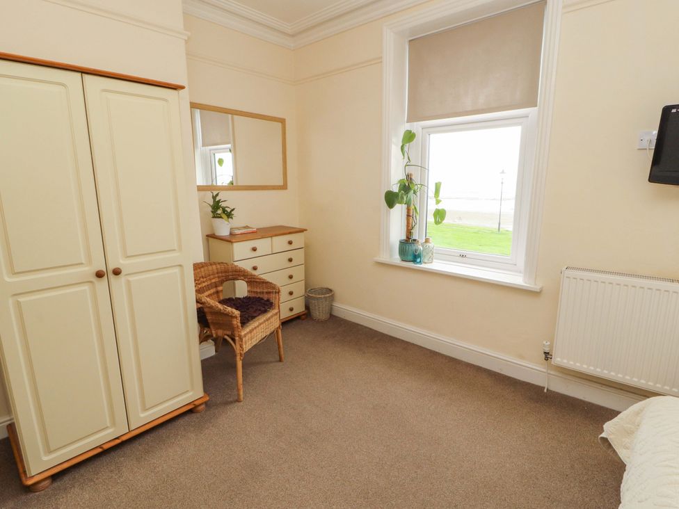 A bedroom with a wardrobe and a chest of drawers at 2 The Crescent