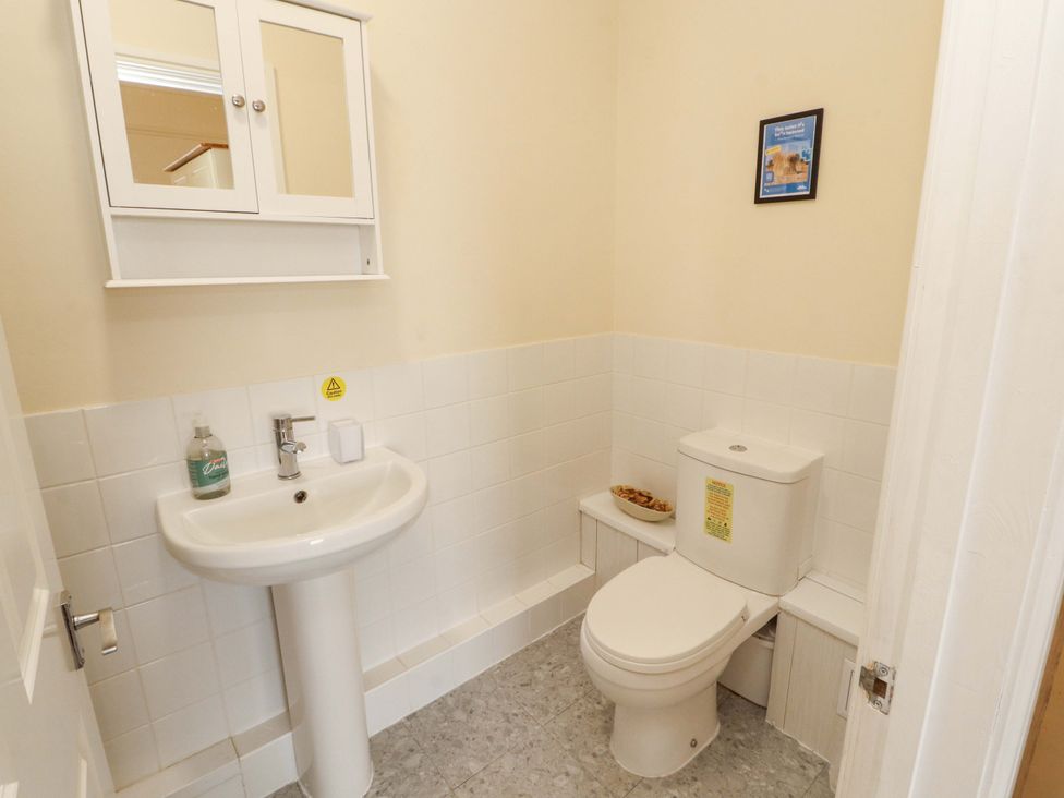 A bathroom with a sink and toilet at 2 The Crescent