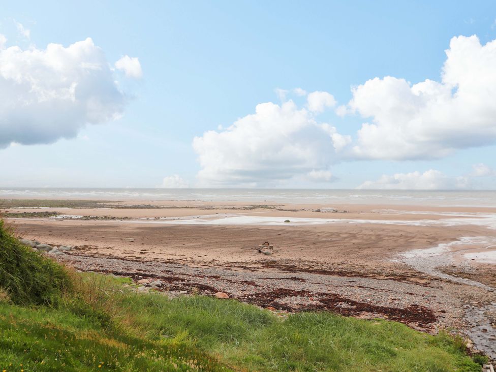 A view of the sea and sand with clouds at 2 The Crescent 