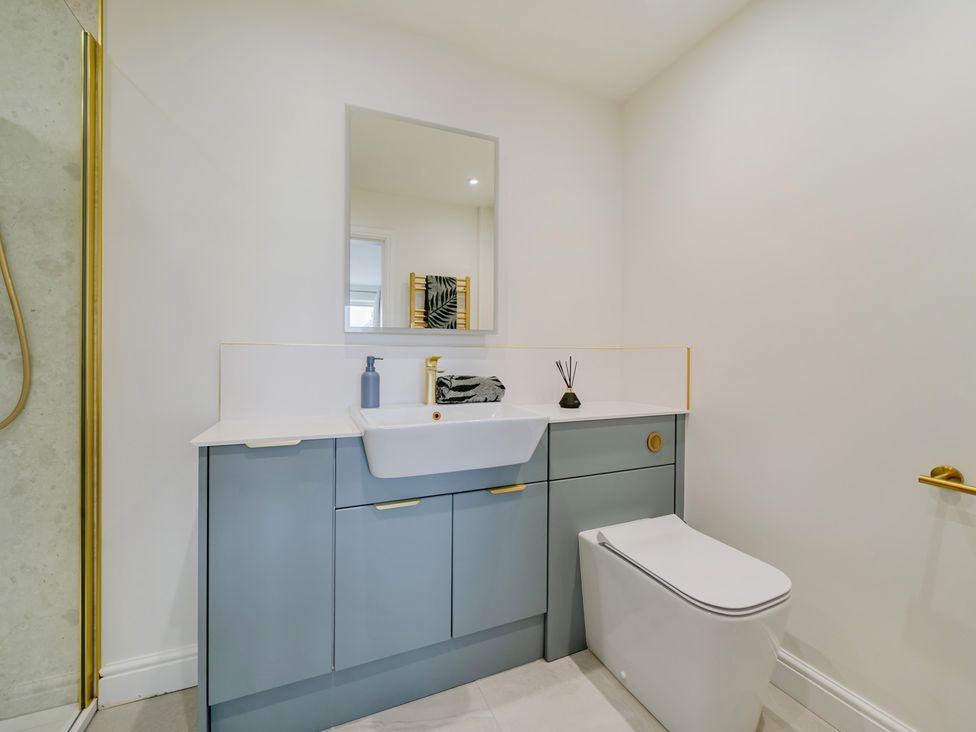 A bathroom with a sink and toilet at Seaddler in Trearddur Bay
