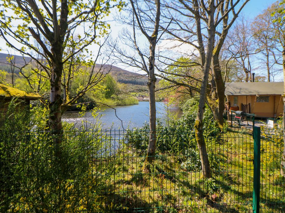 A view of a river surrounded by trees and a building at Dovestone Luxury Lodges (sleeps 4)- pet free Greenfield