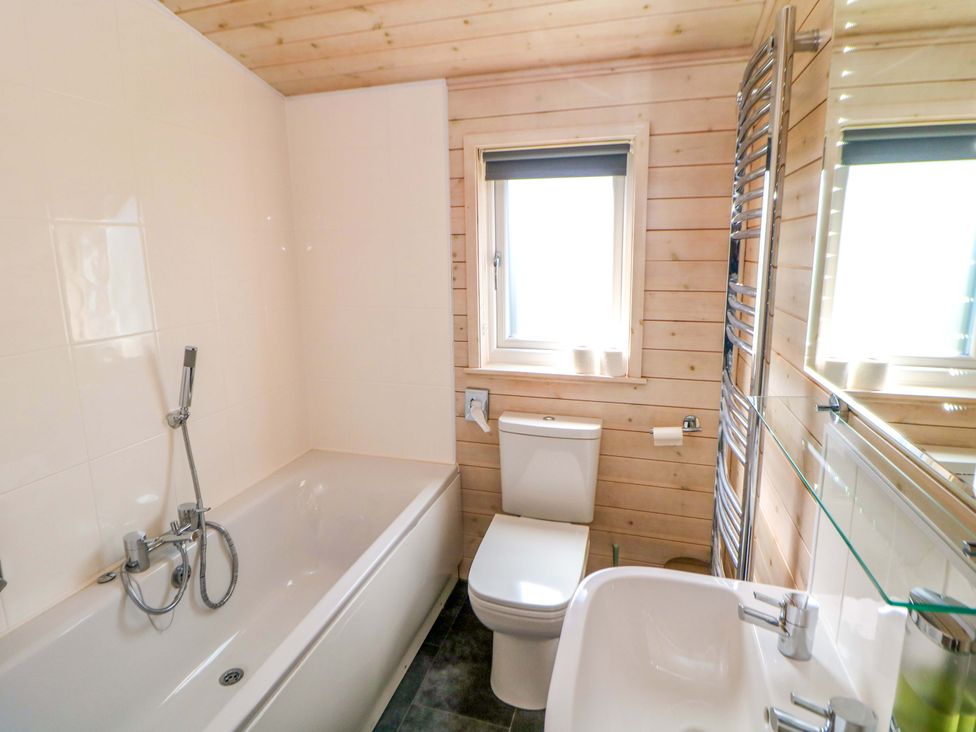 A bathroom with a shower and sink at Dovestone Luxury Lodges (sleeps 4)- pet free, Greenfield