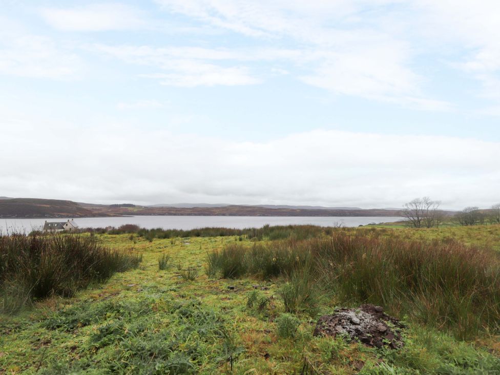 A view of grassland near a body of water at Faodail House Portree
