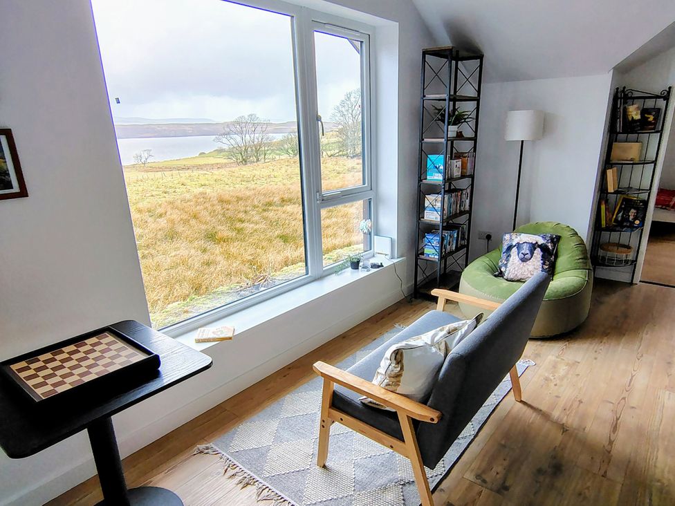 A living room with a view of the landscape at Faodail House Kingsburgh near Uig