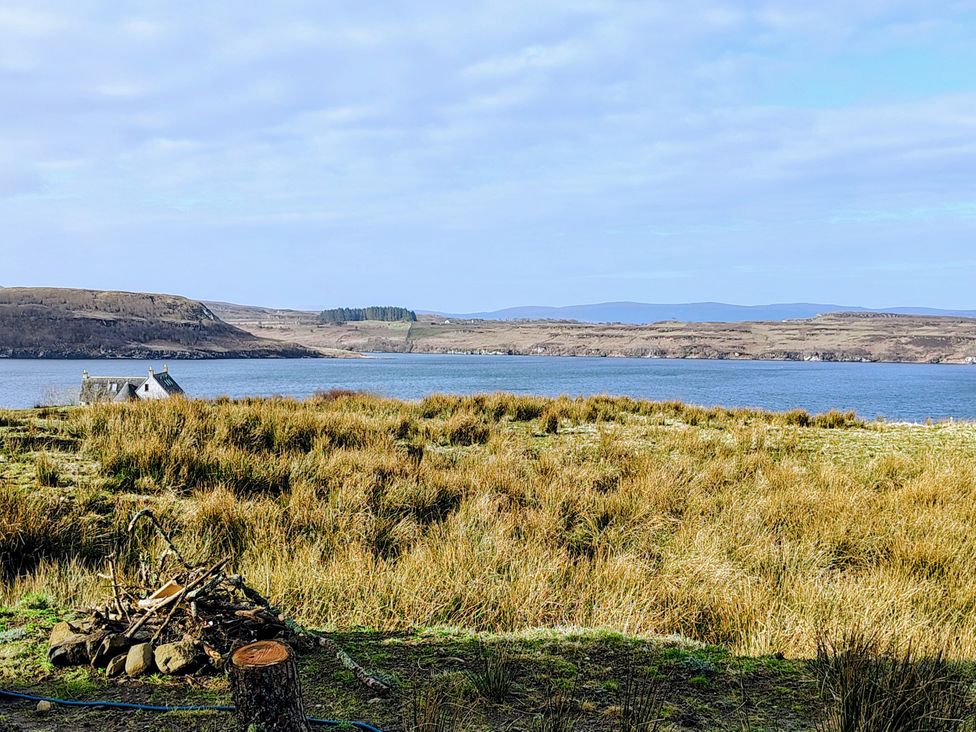 A view of a house by the water at Faodail House Kingsburgh near Uig