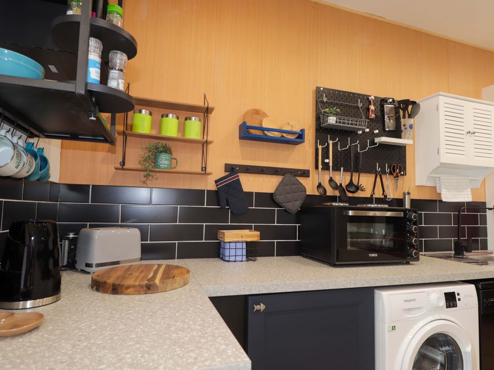 A kitchen with appliances and utensils at Faodail Studio
