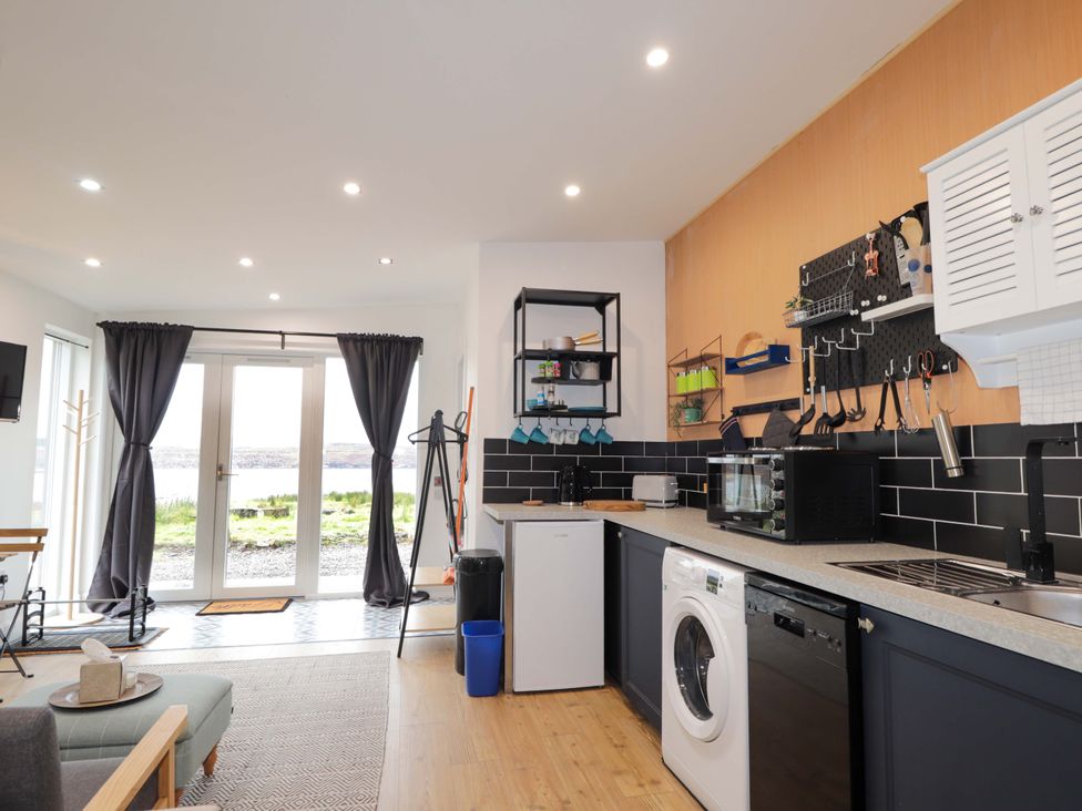 A kitchen with appliances and utensils at Faodail Studio