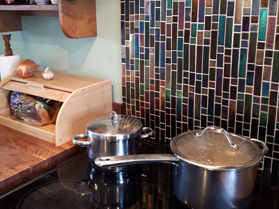 A kitchen with pots and bread box at Taigh Phinc, Balemore near Lochmaddy, North Uist