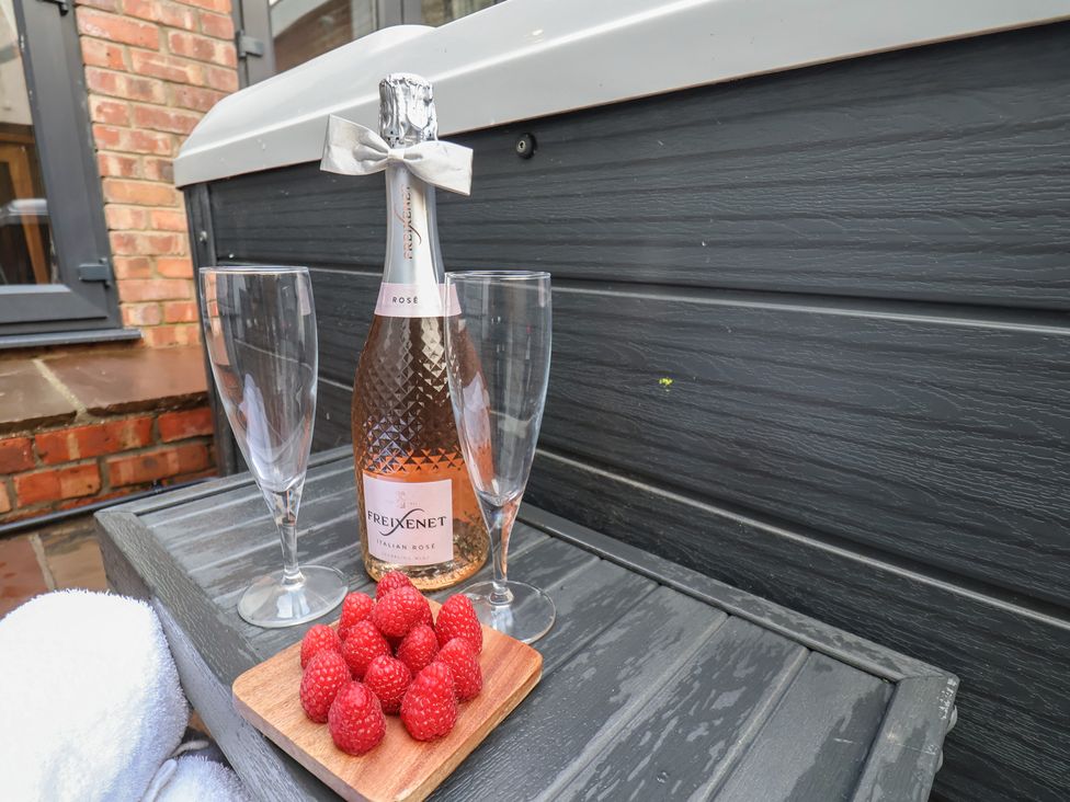 A bottle of Freixenet with glasses and raspberries at Rutland Grange in Filey