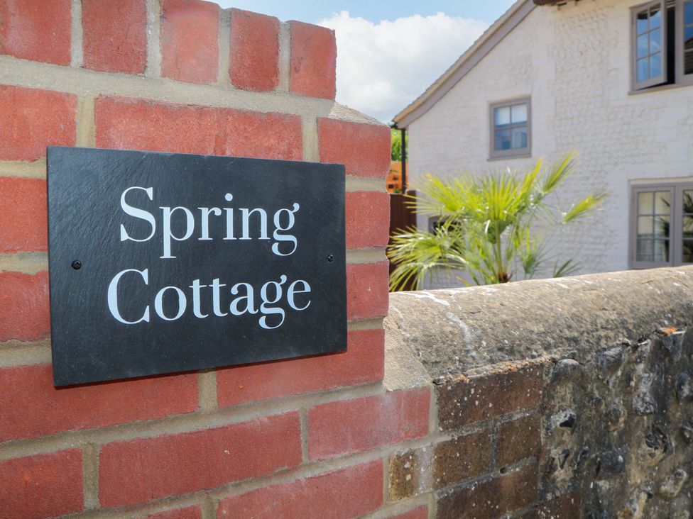 A sign with the name Spring Cottage at Spring Cottage in Arundel, West Sussex