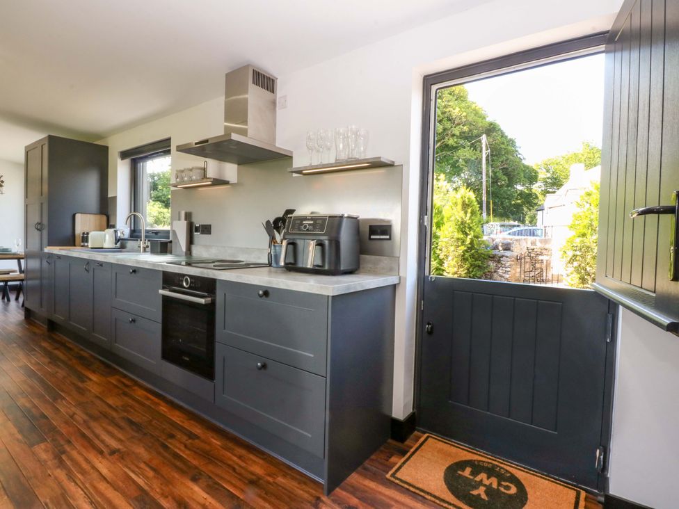A kitchen with a counter and sink at Y Cwt Moelfre