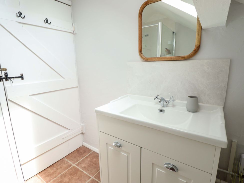 A bathroom with a sink and mirror at Wood Farm Cottage Stickney near East Kirkby