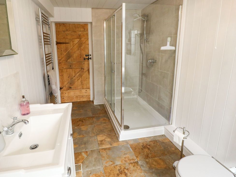 A bathroom with a shower and sink at Wood Farm Cottage Stickney near East Kirkby
