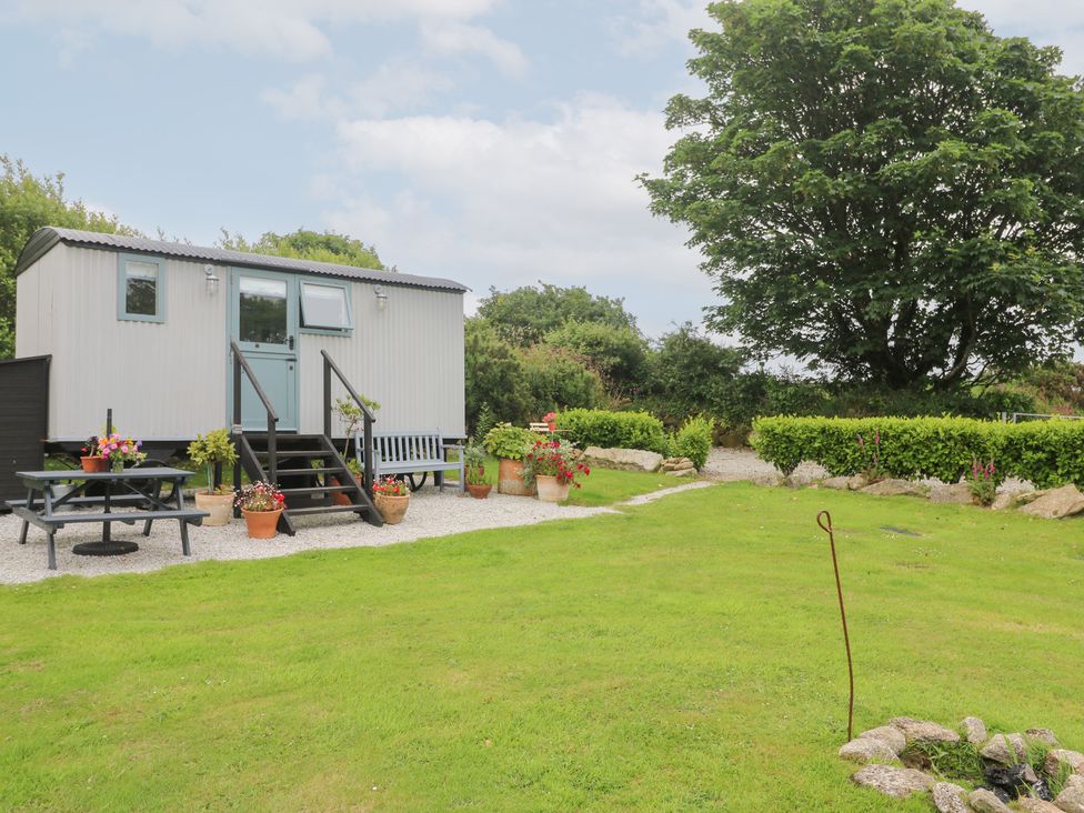 An outdoor area with a house-shaped structure and garden at Teg in Prospidnick near Porthleven