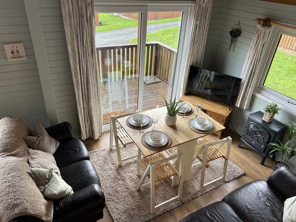 A dining room with a table set for four at Number 39 Bodmin