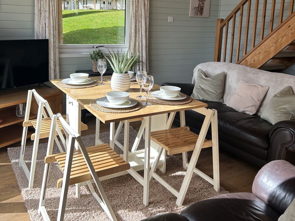 A dining room with a table and chairs at Number 39 Bodmin