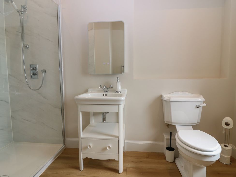 A bathroom with a shower, sink, and toilet at No 6 - 2 bed Haddington