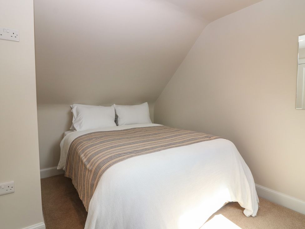 A bedroom with a bed and pillows at No 6 - 2 bed Haddington