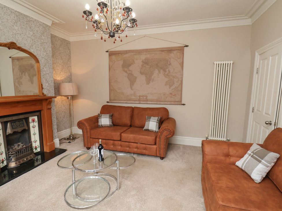 A living room with sofa and coffee table at 11 Rutland Street in Filey
