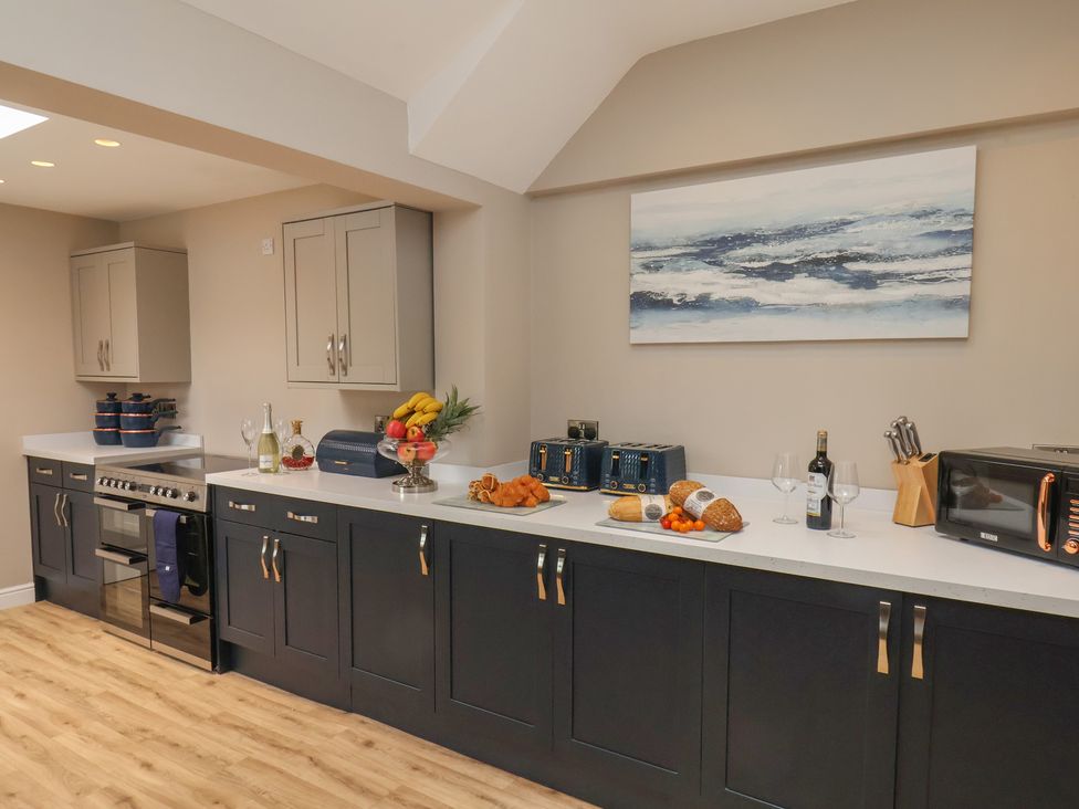 A kitchen with oven and cabinets at 11 Rutland Street in Filey
