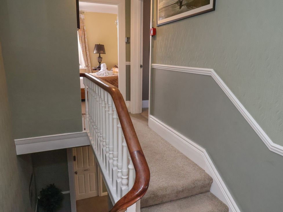 A staircase leading to a hallway at 11 Rutland Street Filey