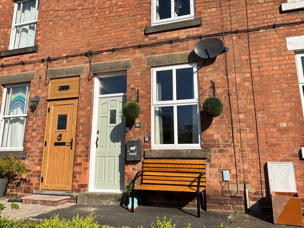 The front entrance of a house with a bench and postbox at 97 Mayfield Road Ashbourne