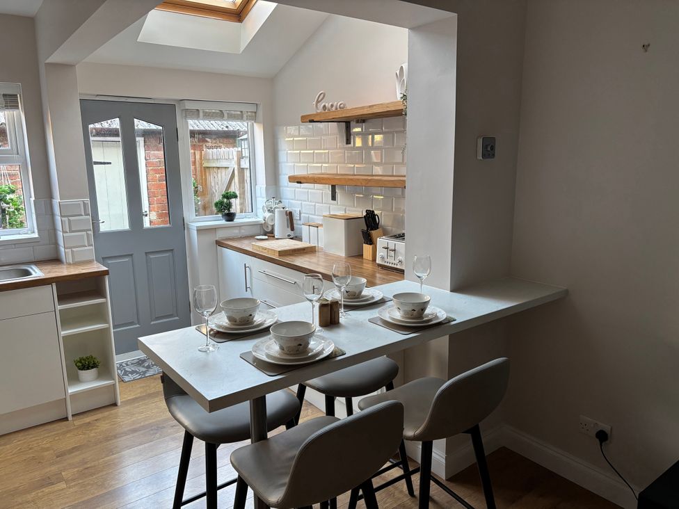 A kitchen with table and chairs at 97 Mayfield Road Ashbourne