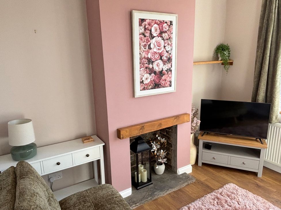 A living room with a sofa and a television at 97 Mayfield Road in Ashbourne