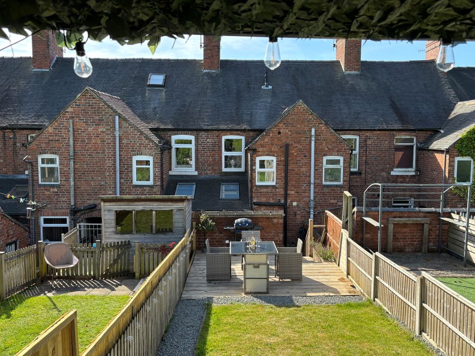 A garden with furniture and a shed at 97 Mayfield Road in Ashbourne