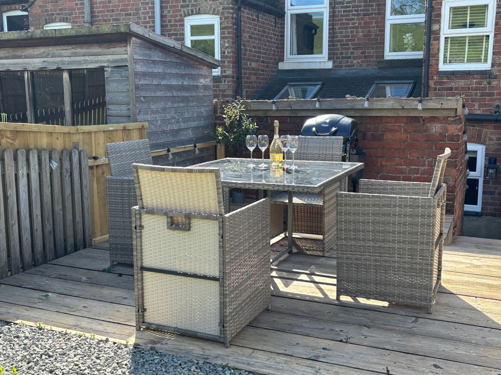 An outdoor patio with a table and chairs at 97 Mayfield Road Ashbourne