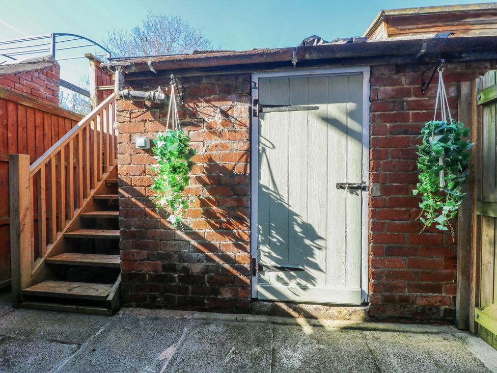 An outdoor area with a door and stairs at Hill View Cottage in Ashbourne