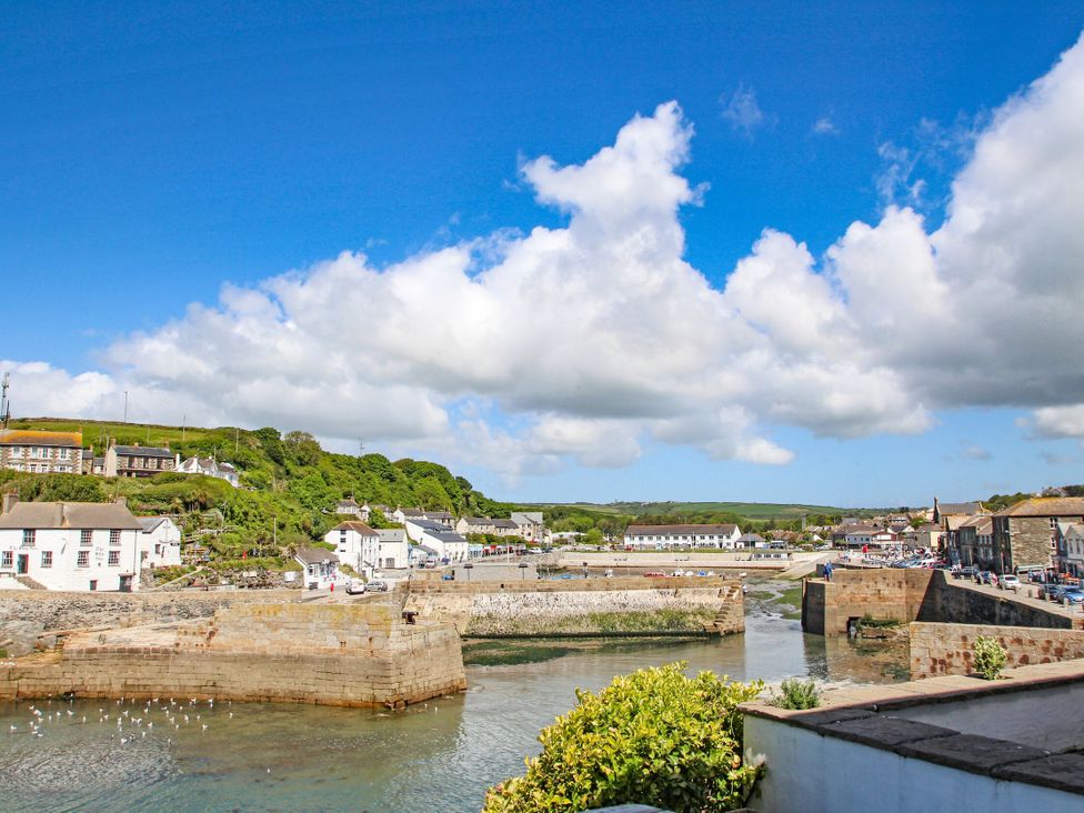 A harbor with water and buildings in Porthleven