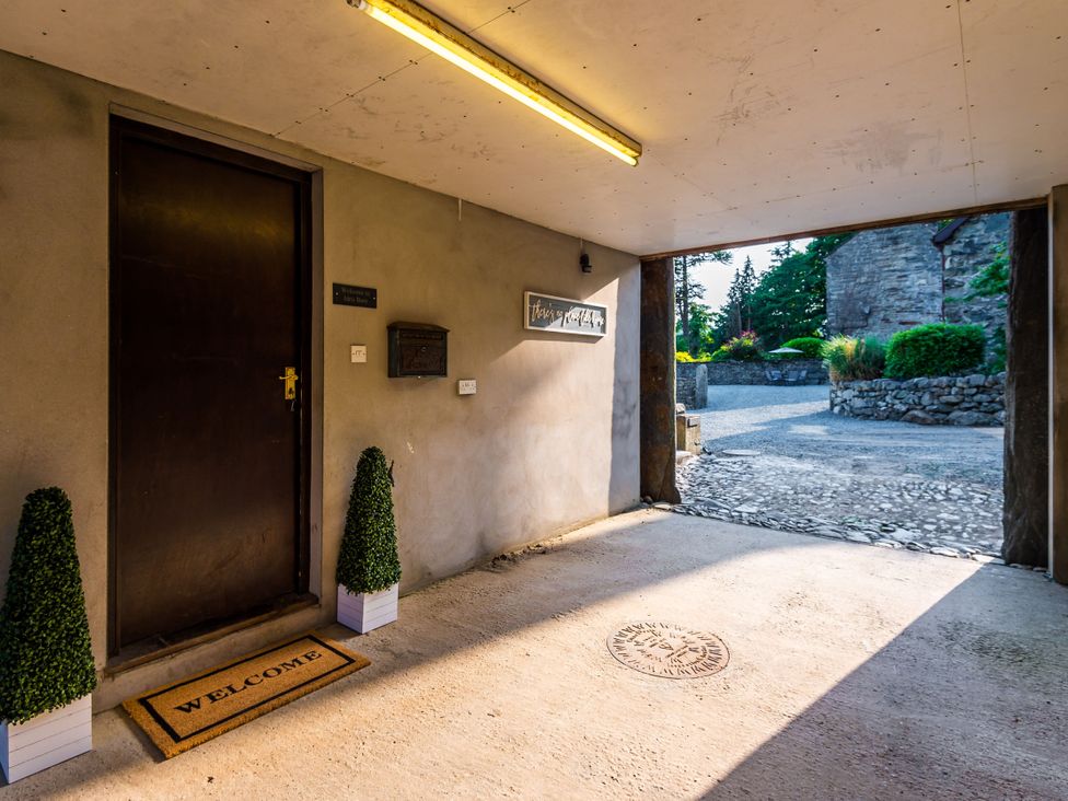 An entrance with a door and welcome mat at Idris Barn in Dolgellau