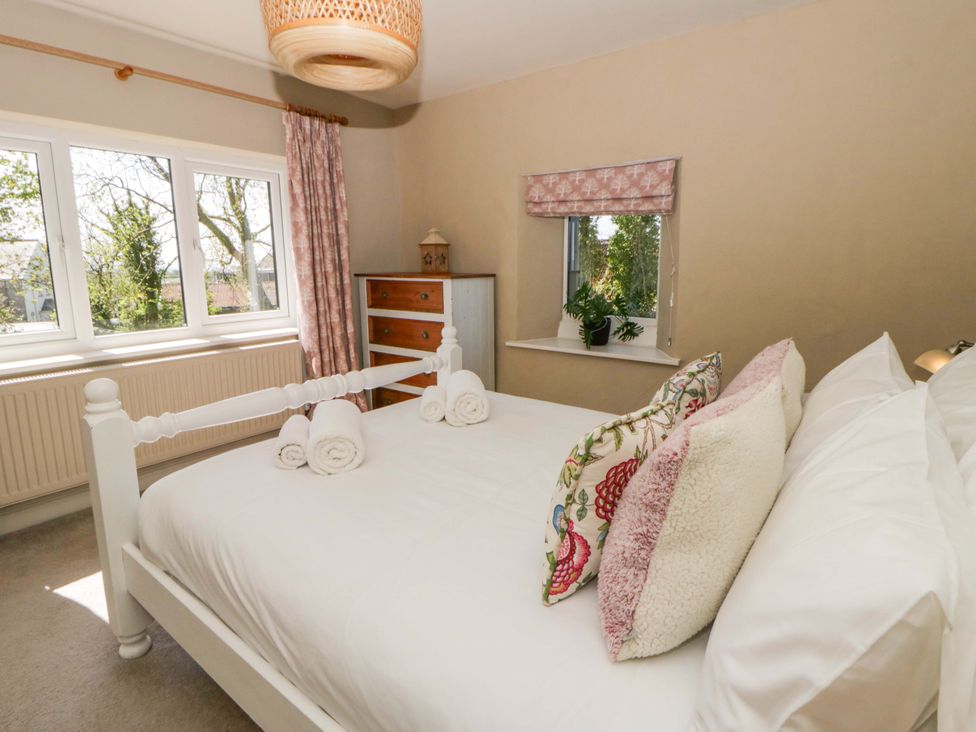 A bedroom with a bed and dresser at La Bastille in Maenclochog