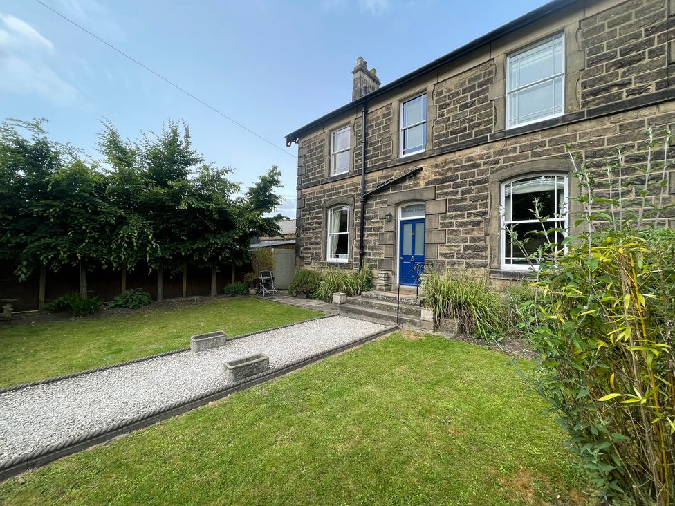 A house with a garden and pathway at Deeley House in Darley Dale