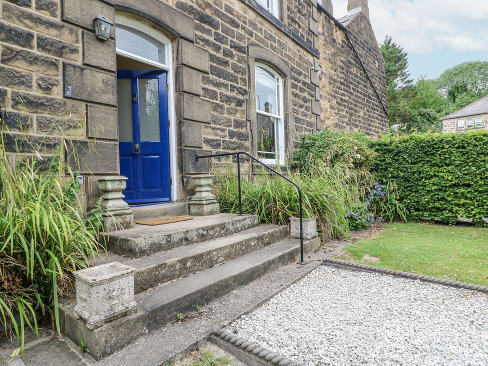 An outdoor area with steps leading to a front door at Deeley House in Darley Dale