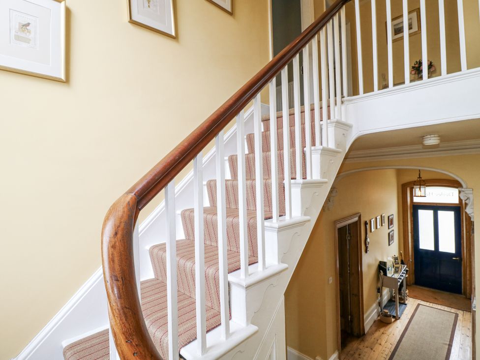 A staircase and door at Deeley House in Darley Dale